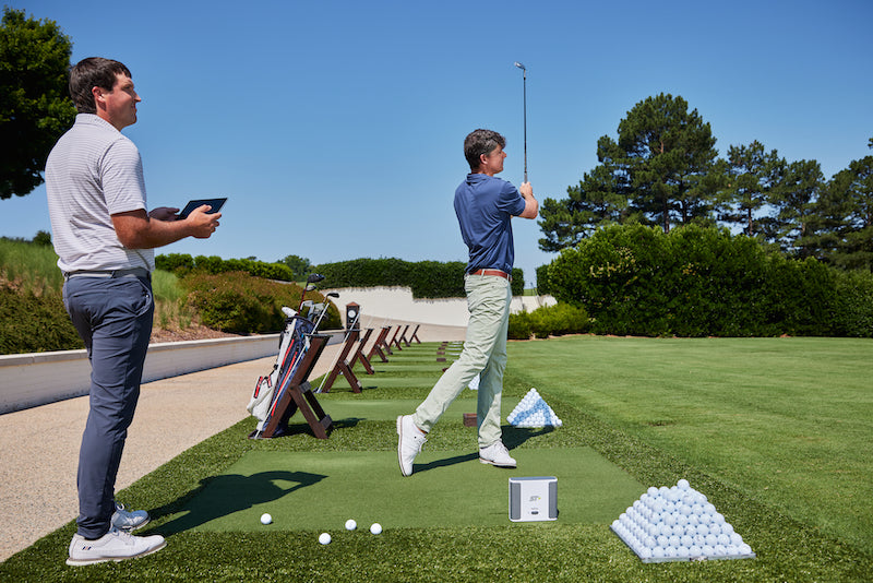 Man Playing golf outdoors on SKYTRAK plus launch monitor