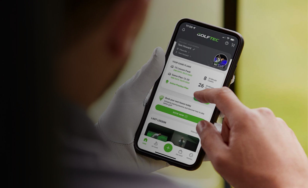 Guy using the GOLFTEC app for game improvement