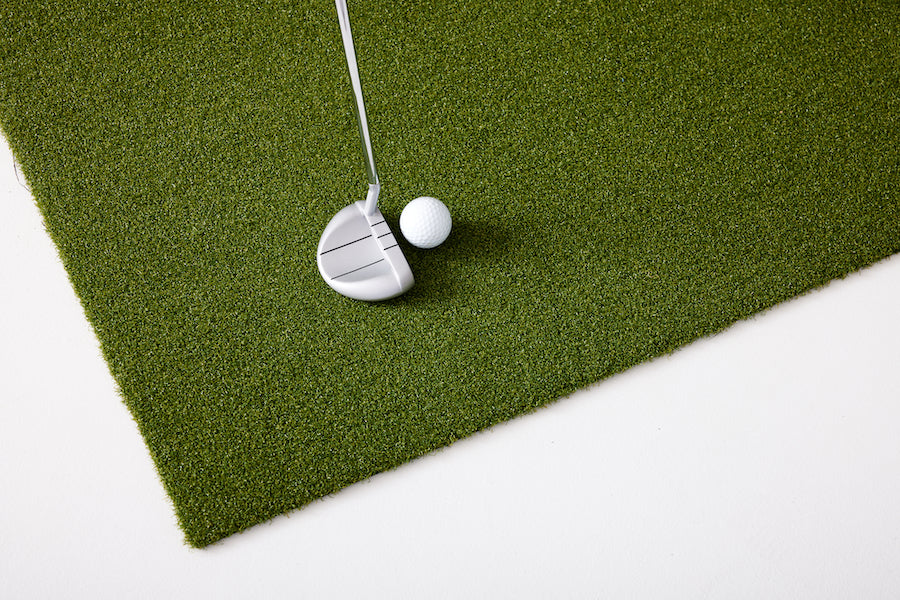 Close up of putter and golf ball on the putting turf SkyTrak golf simulation accessories